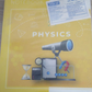 DOMS Physics Practical Book 132 Pages cover featuring a telescope, hourglass, and various physics graphics on a yellow background.